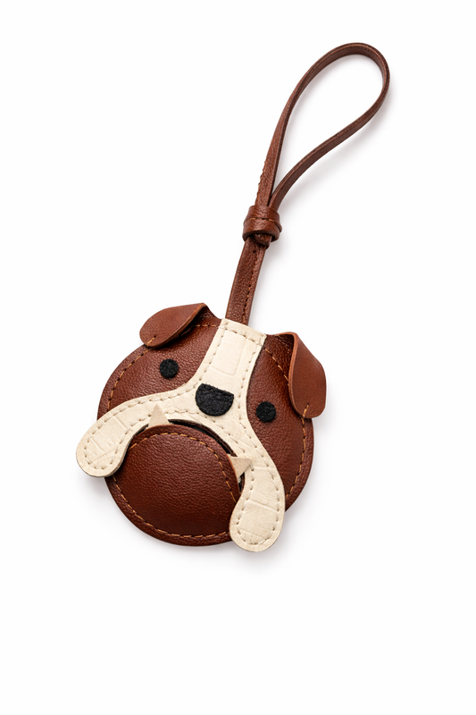 Dog-shaped keychain with brown and beige colors on a white background