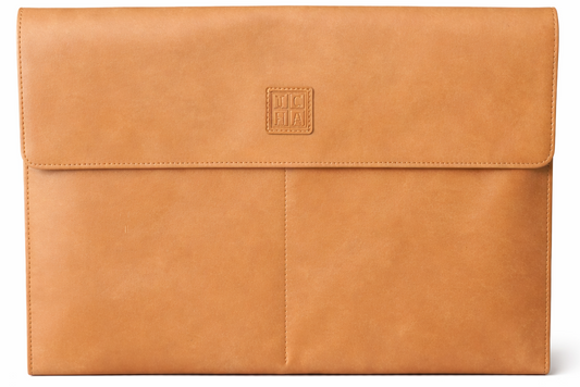 Tan leather laptop sleeve with a brand logo on a white background
