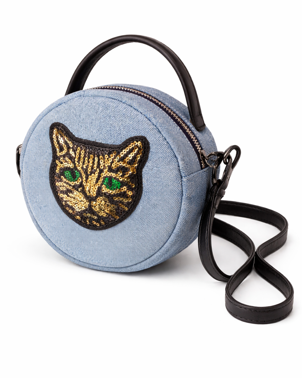 Round blue bag with embroidered cat face design on a white background