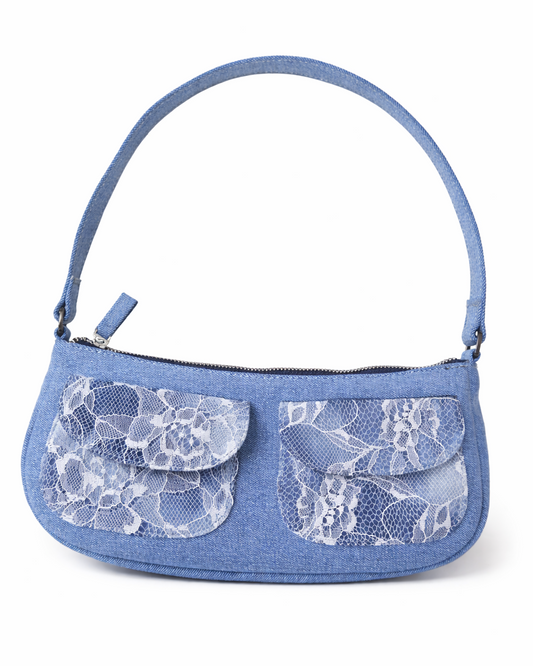 Blue handbag with lace details on a white background